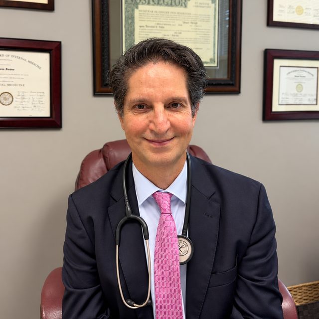 Dr. Farzad Forohar, MD, at his desk